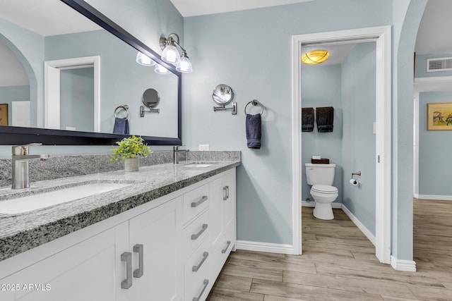 4116 E Downing St, Mesa, AZ 85205 - bathroom featuring double vanity and wood finished floors