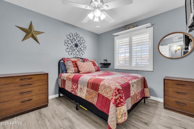 4116 E Downing St, Mesa, AZ 85205 - bedroom with wood finished floors and a ceiling fan