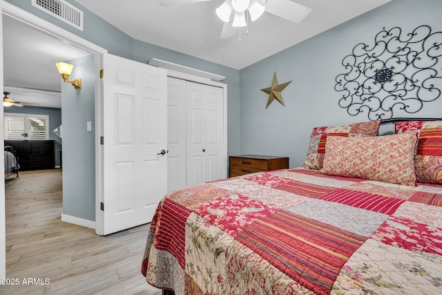 4116 E Downing St, Mesa, AZ 85205 - bedroom featuring light wood finished floors, a closet, and ceiling fan