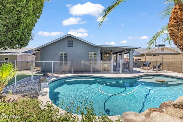 4116 E Downing St, Mesa, AZ 85205 - view of swimming pool featuring a shed, a fenced backyard, a patio, and a ceiling fan
