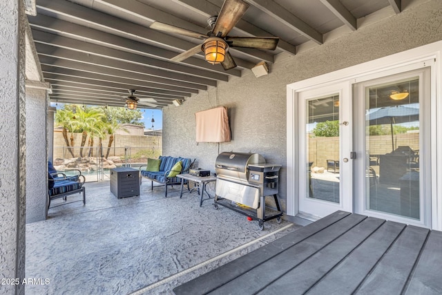 4116 E Downing St, Mesa, AZ 85205 - fenced backyard with area for grilling, ceiling fan, an outdoor hangout area, and a patio