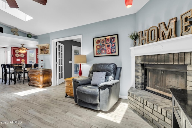 4116 E Downing St, Mesa, AZ 85205 - living room with ceiling fan, lofted ceiling, a skylight, and wood finished floors