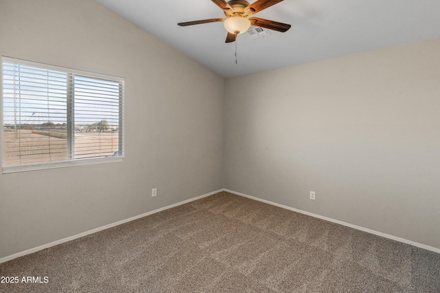 unfurnished room with carpet floors, ceiling fan, and vaulted ceiling