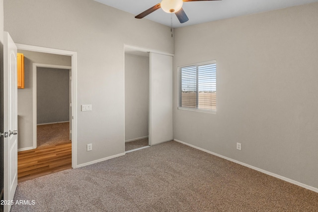 unfurnished bedroom with ceiling fan, a closet, and carpet floors