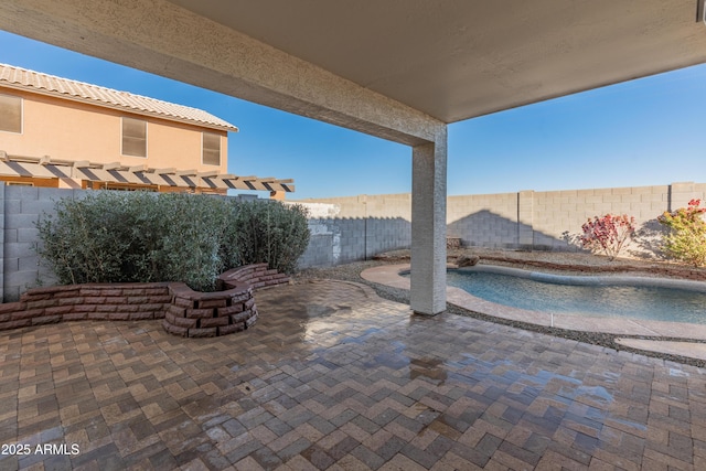 view of patio / terrace featuring a fenced in pool