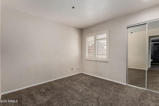 154 W 5th St Unit 210, Tempe, AZ 85281 - unfurnished bedroom featuring dark colored carpet and a closet