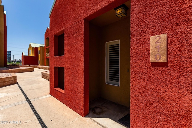 154 W 5th St Unit 210, Tempe, AZ 85281 - view of side of home with stucco siding and a patio area