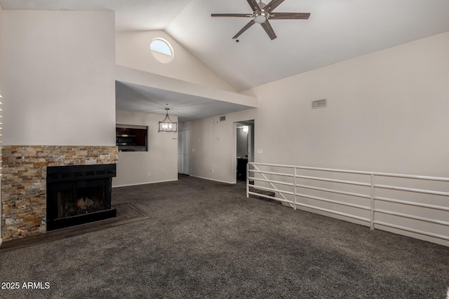 154 W 5th St Unit 210, Tempe, AZ 85281 - unfurnished living room with dark colored carpet, high vaulted ceiling, a fireplace, and a ceiling fan