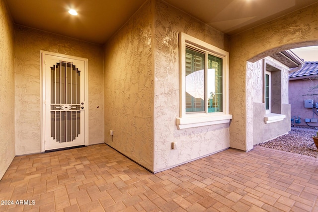 doorway to property featuring a patio