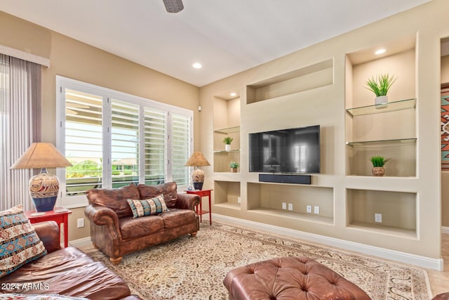 living room featuring built in shelves