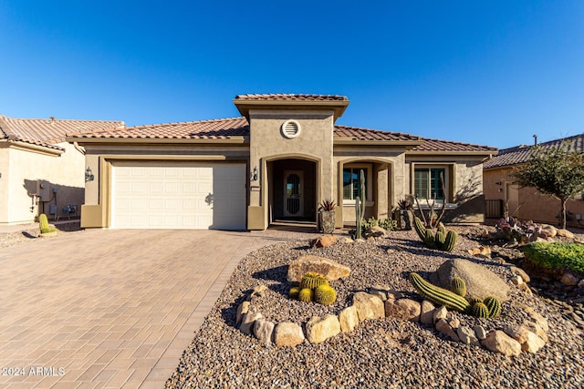 mediterranean / spanish-style house featuring a garage