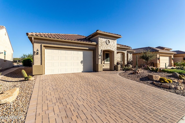 mediterranean / spanish-style home featuring a garage