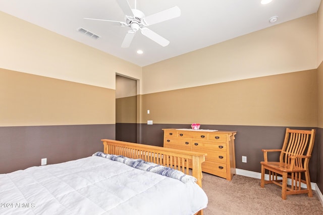 bedroom with ceiling fan and light carpet