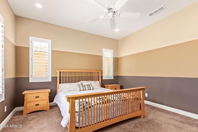 carpeted bedroom with ceiling fan