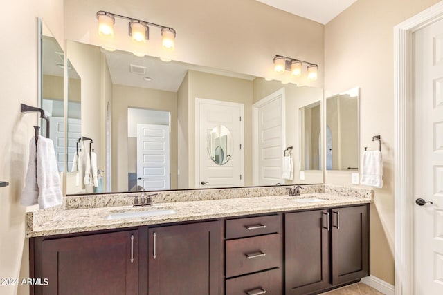 bathroom with vanity and tile patterned floors