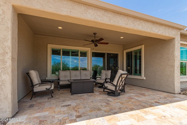 view of patio with outdoor lounge area and ceiling fan