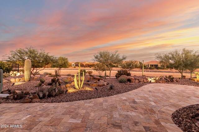 view of patio terrace at dusk