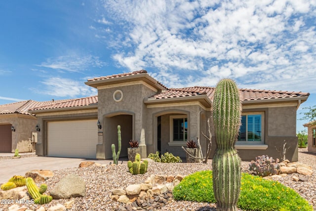 mediterranean / spanish-style house featuring a garage