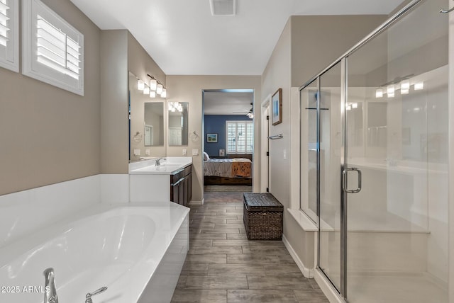 bathroom featuring a garden tub, vanity, visible vents, a stall shower, and ensuite bath