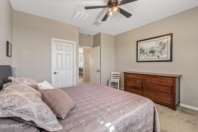 bedroom with baseboards, a ceiling fan, visible vents, and light colored carpet