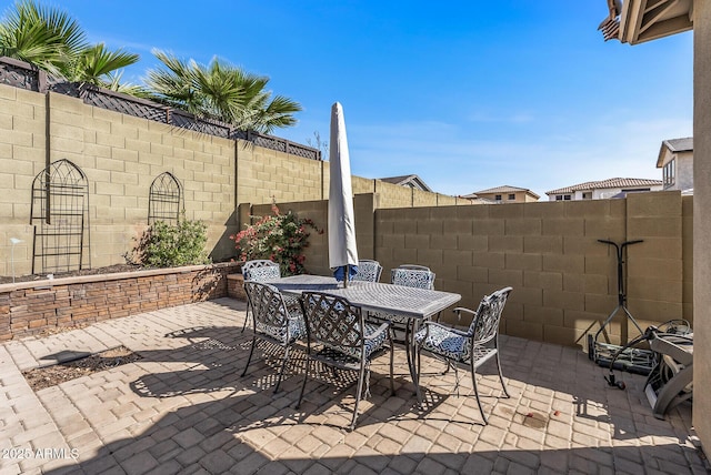 view of patio featuring fence private yard and outdoor dining area