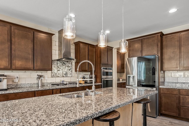 kitchen featuring light stone countertops, tasteful backsplash, and appliances with stainless steel finishes