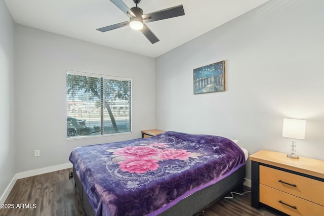 bedroom with dark wood-type flooring and ceiling fan