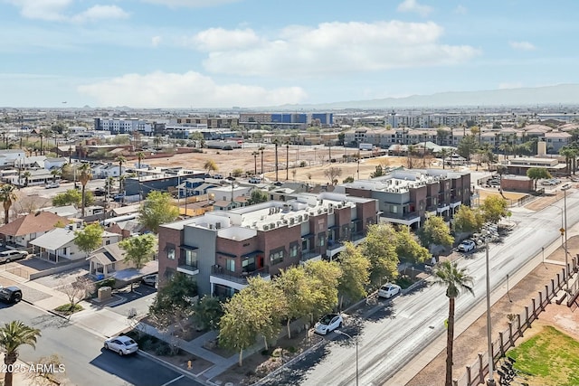 birds eye view of property featuring a mountain view