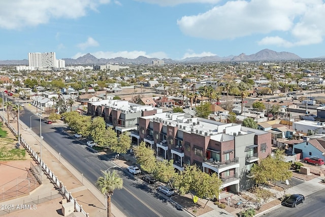 birds eye view of property featuring a mountain view