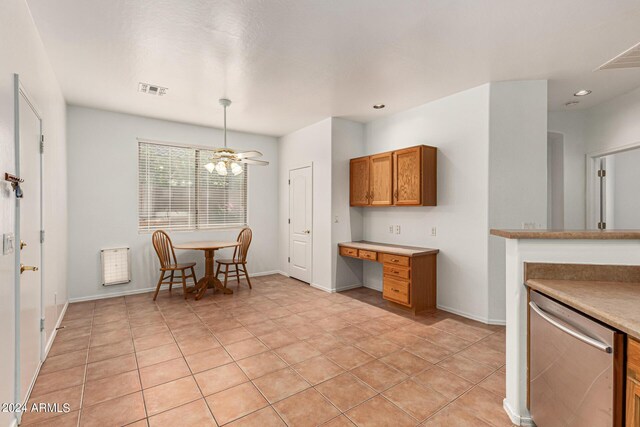 spare room featuring wood-type flooring and ceiling fan