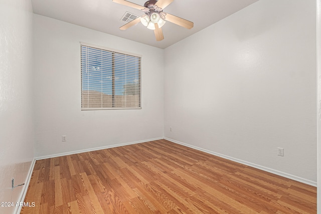 unfurnished room with ceiling fan and light hardwood / wood-style flooring