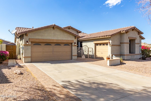 mediterranean / spanish-style house featuring a garage