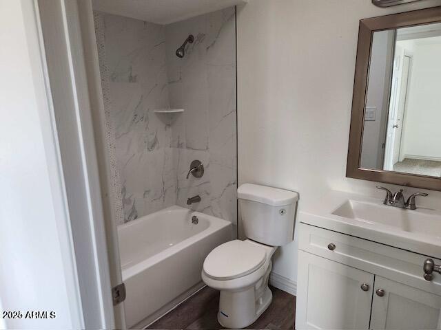 full bathroom with vanity, toilet, and tiled shower / bath combo