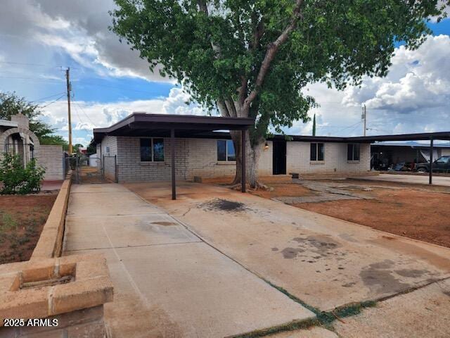 view of front of property featuring a carport