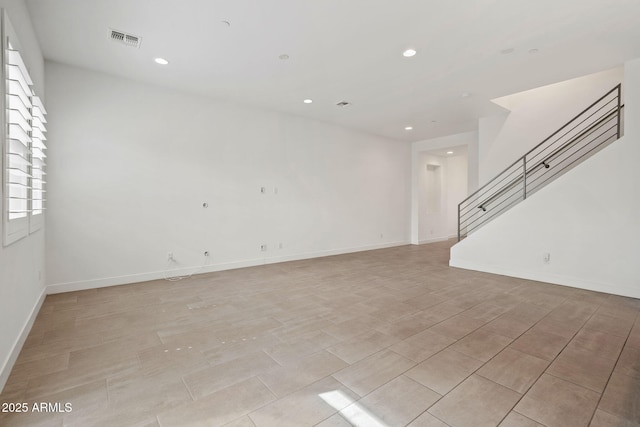 unfurnished room with stairs, recessed lighting, visible vents, and baseboards