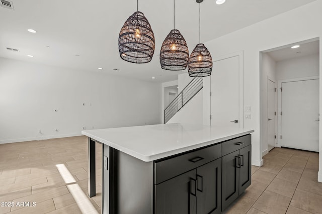 kitchen featuring recessed lighting, visible vents, open floor plan, and light countertops