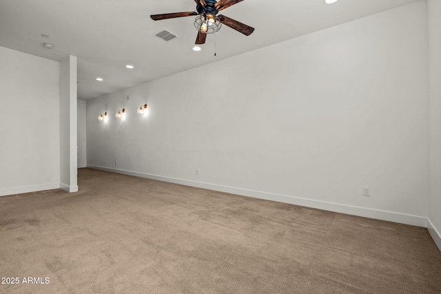 carpeted spare room featuring visible vents, recessed lighting, baseboards, and a ceiling fan