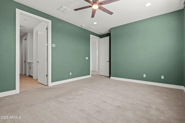 unfurnished bedroom featuring visible vents, baseboards, and carpet