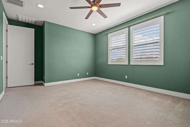 carpeted spare room with recessed lighting, baseboards, visible vents, and ceiling fan