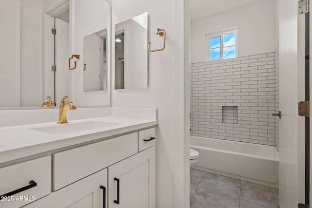 bathroom featuring toilet,  shower combination, vanity, and tile patterned flooring