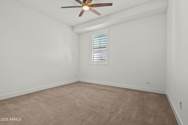 spare room with light carpet, baseboards, and ceiling fan