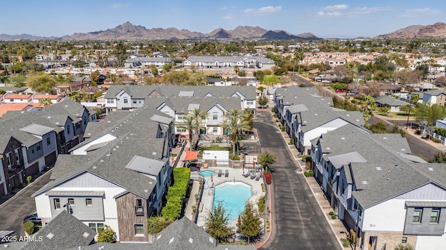 drone / aerial view featuring a residential view and a mountain view