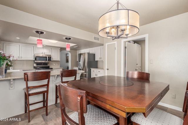 dining room with a chandelier