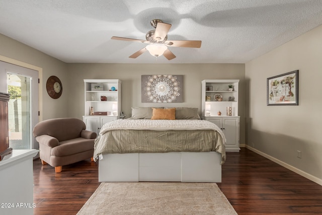 bedroom featuring ceiling fan, dark hardwood / wood-style flooring, a textured ceiling, and access to outside