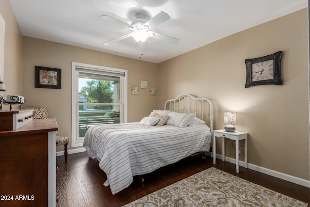 bedroom featuring ceiling fan and dark wood-type flooring