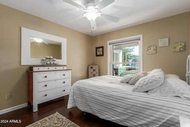 bedroom with ceiling fan and dark hardwood / wood-style flooring