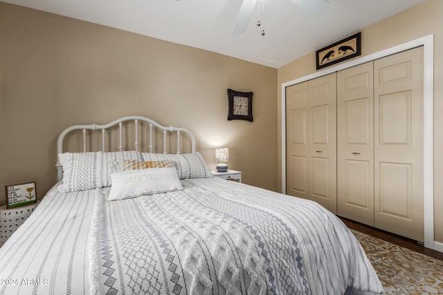 bedroom featuring hardwood / wood-style flooring, a closet, and ceiling fan