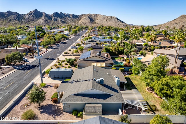 birds eye view of property with a mountain view