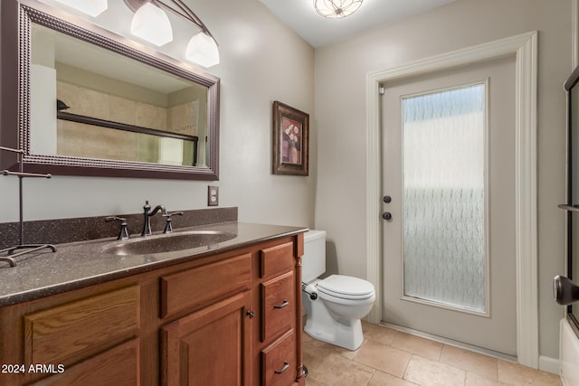 full bathroom with vanity, toilet, and enclosed tub / shower combo