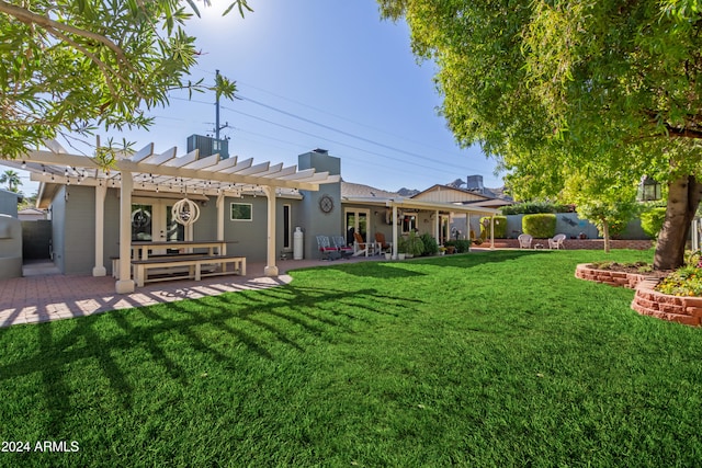 view of yard with a patio area, a pergola, and central AC